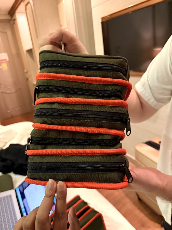 DashKit prototype held vertically, accordion panels unfolding